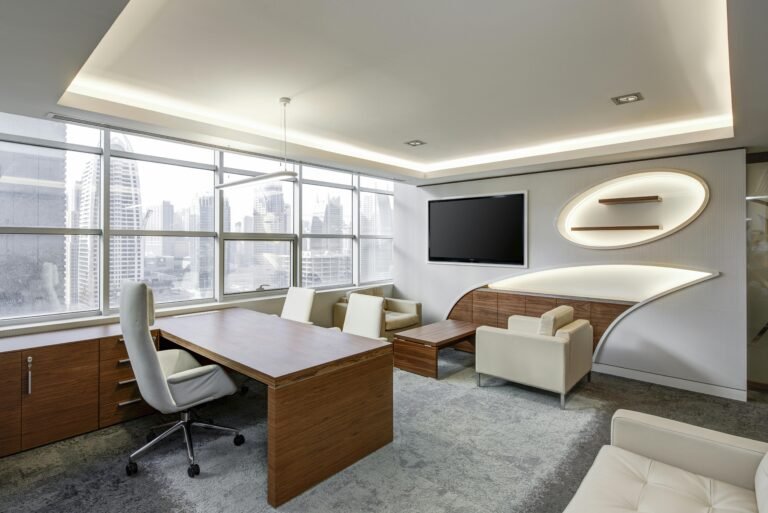 Sleek office space featuring contemporary furniture and city skyline views, ideal for professionals.